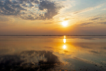 Fototapeta na wymiar Sunset over Tuzly lagoons national park in Lebedivka, Ukraine
