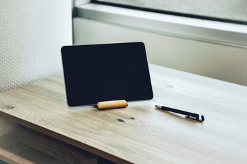 Digital tablet on a wooden table
