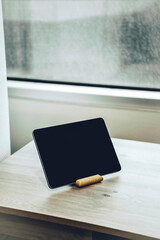 Digital tablet on a wooden table