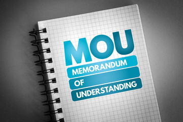 MOU - Memorandum Of Understanding acronym on notepad, business concept background