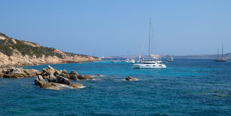 Fototapeta na wymiar boats in the archipelago La Maddalena - travel destination - summer in Sardinia.