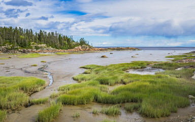 Rocky shoreline on the St Lawrence river near Raguneau in Cote Nord of Quebec, Canada