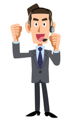 ガッツポーズするヘッドセットを装着した男性オペレーター
