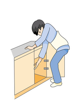 台に手をついてしゃがむ腰椎コルセットの人物