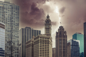 Fototapeta na wymiar Chicago skyscrapers at rainy day with stormy sky with lightning strike background