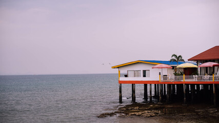 house by the sea on stilts in tailand 