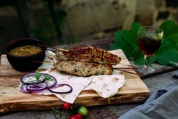 Lula kebab on pita bread with vegetables