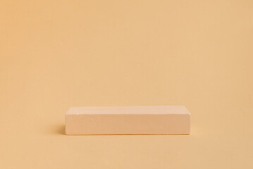 Сoncrete stage of rectangular shape on beige background. Empty showcase for product presentation. eco style and minimalism. 