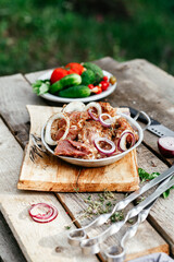 Marinated pork for shish kebab in an iron micron. Raw meat