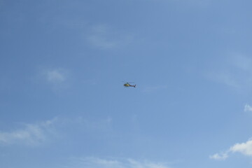 a helicopter is flying in the sky