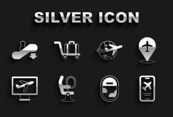 Fototapeta premium Set Airplane seat, Plane, Mobile with ticket, window, Globe flying, Escalator down and Trolley baggage icon. Vector