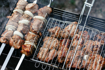 The meat is grilled on the grill. Shashlik
