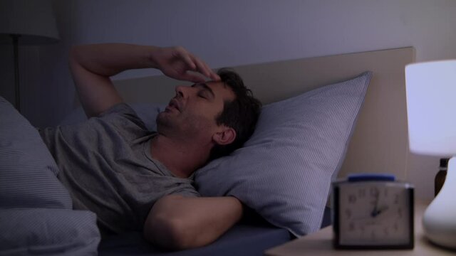 Video about stressed man suffering from sleep problem and insomnia
