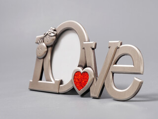 stylish word LOVE with place for photo on gray background