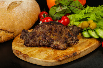 Roasted pork liver steak isolated