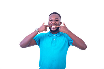 portrait of a young man showing his teeth, happy.