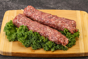 Raw minced beef kebab skewer