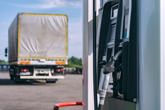 Fuel filling station in the background of a truck for transportation.