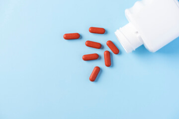 Red Pills Tablets Spill from Medicine Drug Container Bottle