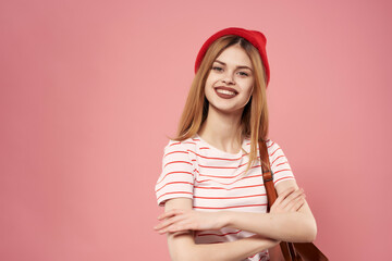 smiling woman in red hat fashionable clothes emotions pink background