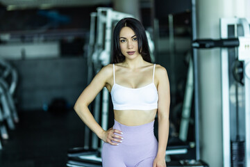 Portrait of sexy young woman ready for workout at gym