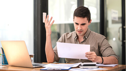 business man seriously analyzing business data, clear, hard work, busy, business bankruptcy, low profit