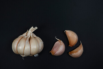 garlic placed on a black background