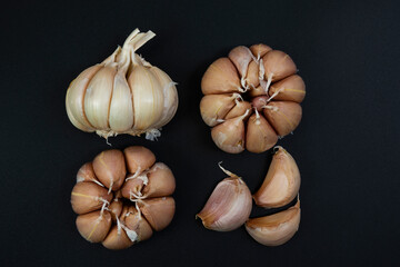 garlic placed on a black background