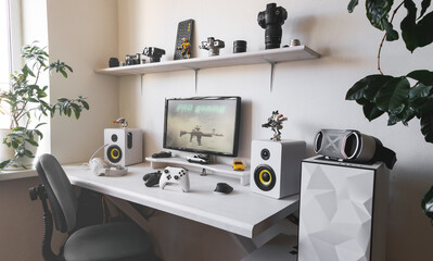 General view home workplace of gamer with computer and gamepad.  © Aboltin