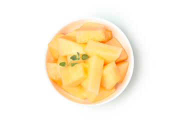 Plate with melon pieces isolated on white background