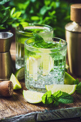Refreshing Mojito with Ice Mint and Lime on Woodden Table