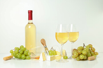 Concept of white wine tasting on white background