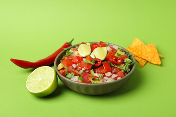 Mexican food concept with Pico de Gallo on green background