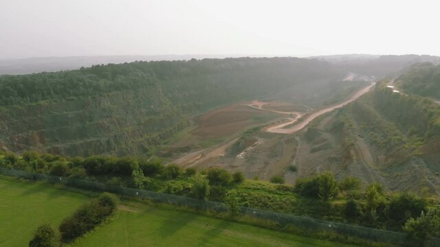 Aerial drone shot of empty quarry in the countryside