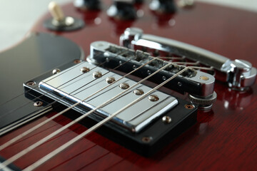 Fototapeta na wymiar Red electric guitar, close up and selective focus