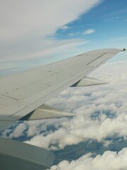 View of the sky , through airplane window.