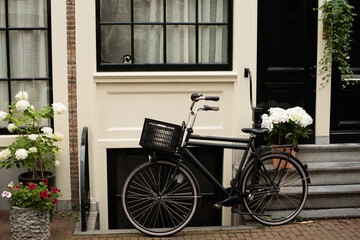 bicycle in front of a house in Amsterdam