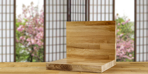 Wooden desk with pedestal for your decoration and free space for your product. Japan blurred window. 