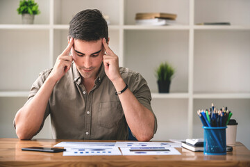 business man seriously analyzing business data, clear, hard work, busy, business bankruptcy, low profit