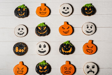 top view of sweet and spooky gingerbread cookies on white surface