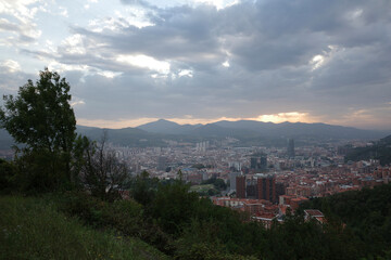Bilbao seen from a hill in a summer cloudy day