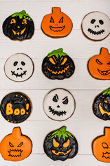 top view of homemade and tasty halloween cookies on white surface