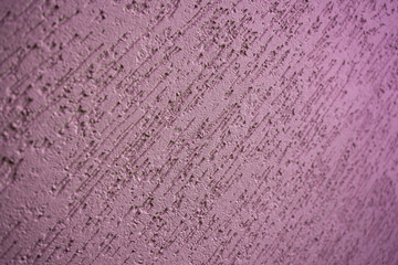 Background from decorative plaster of purple color, a place for text