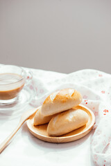 Coffee cup and Breakfast bread on white table