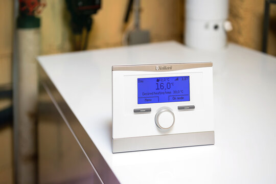 London, United Kingdom - Apr 7, 2021: New Vaillant VRC 700 heating control complete intelligent control for central heating and hot water in boiler room - 2 degrees outside temperature 