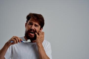 bearded man hygiene toothpaste morning isolated background