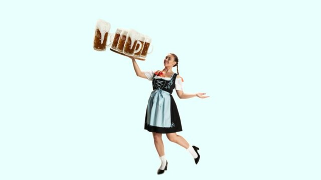 Stop motion design or art animation. The young happy sexy woman wearing a Bavarian dirndl with lot of beer mugs over color traditional background. The celebration, oktoberfest, festival, party concept