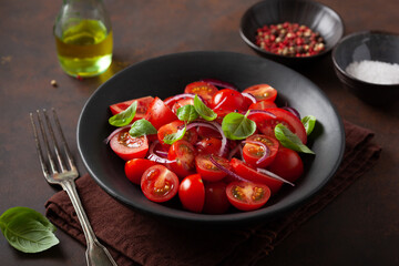 healthy tomato salad with onion basil olive oil and balsamic vinegar