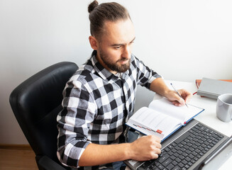 Young man working online at home