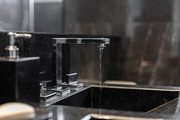 Bathroom faucet with marble tub. Black finish.
